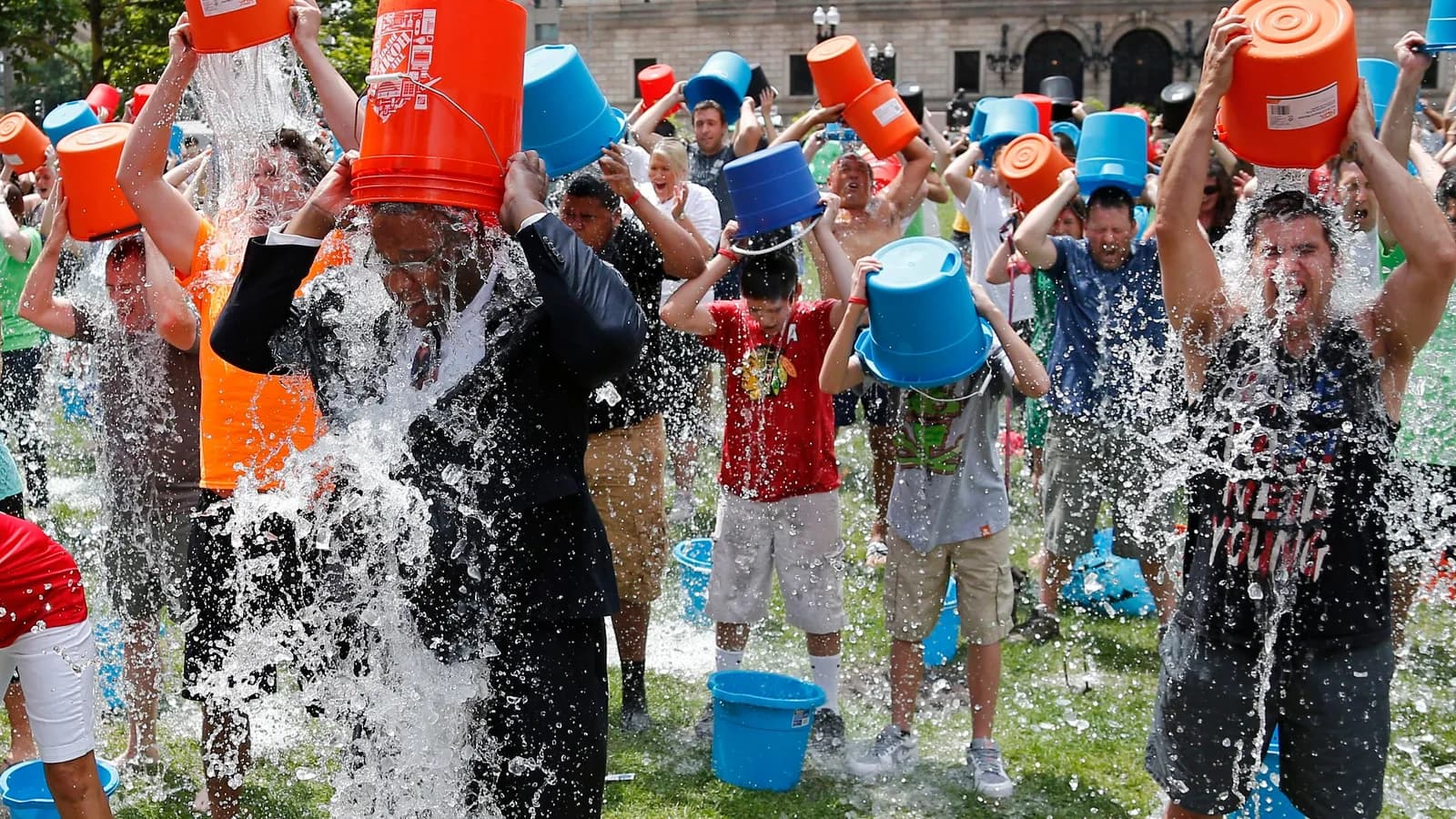 Boston City Councillor Tito Jackson, leads some 200 people in the ice bucket challenge at Boston's Copley Square, Aug. 7, 2014 to raise funds and awareness for ALS.