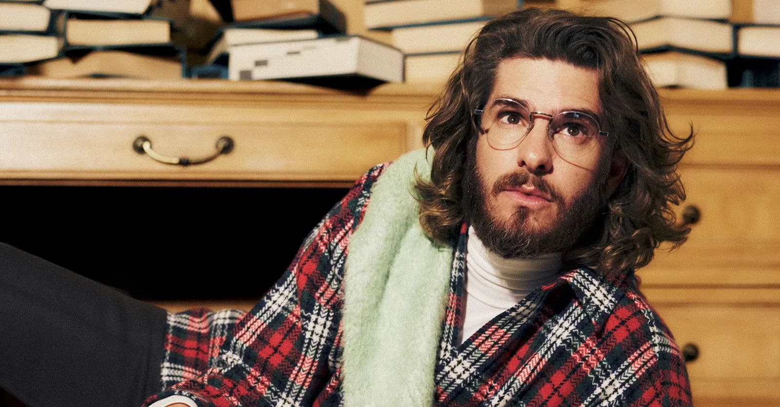 Andrew Garfield wears a plaid shirt while posing for a Who What Wear photo shoot
