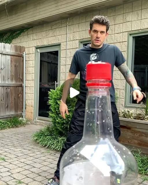 John Mayer on Instagram: "First @erlsn.acr did it. Then @blessedmma followed, and challenged me. I now challenge @jasonstatham. #bottlecapchallenge"