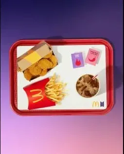 Official BTS Meal product photo showing McNuggets, fries, a drink and the two sauces.