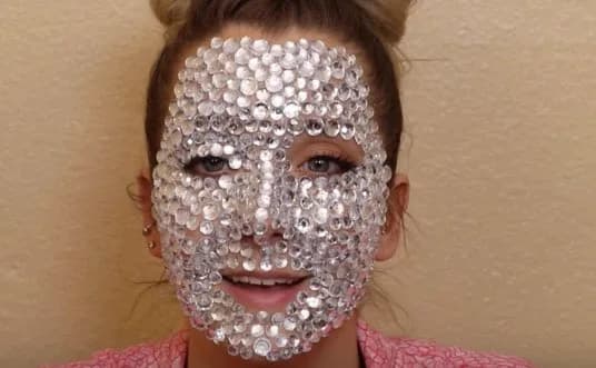 Doja Cat’s high fashion look at the Schiaparelli Haute Couture show was reportedly inspired by the Jenna Marbles 2017 Youtube video - “A Full Face Of Rhinestones ”