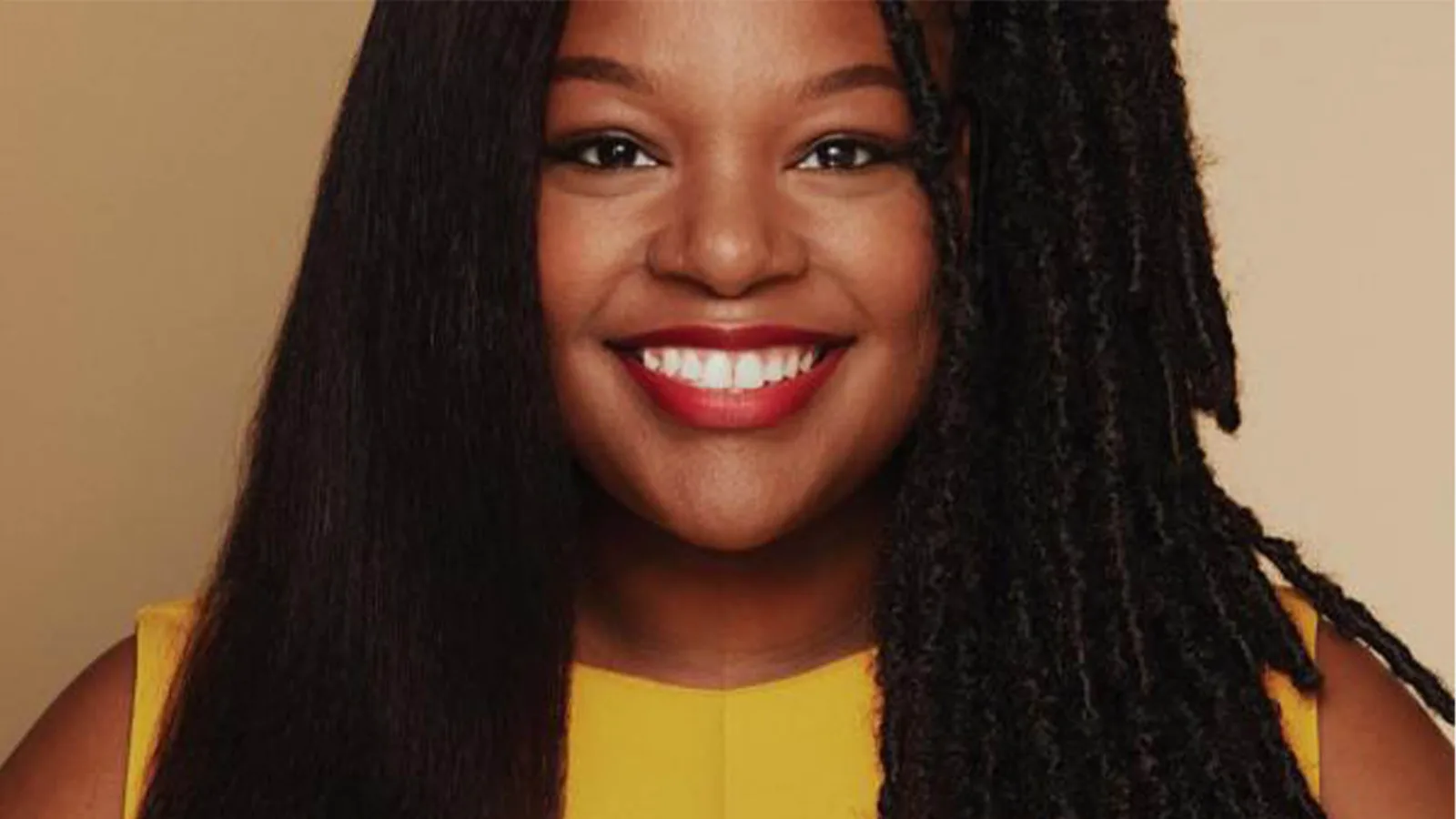Campaign portrait showing straightened hair on one side and natural hair on the other