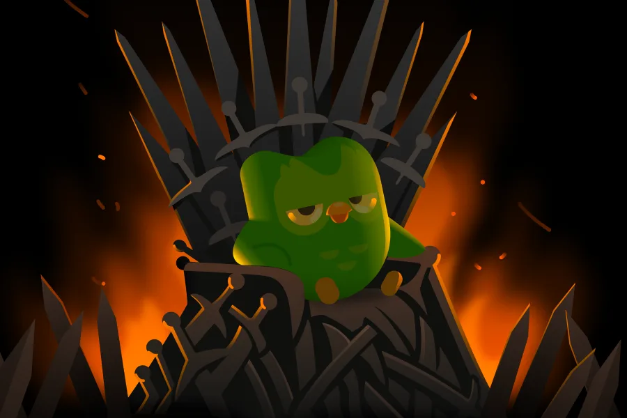 Duo sitting on the Iron Throne, from Duolingo's official course-update blog.