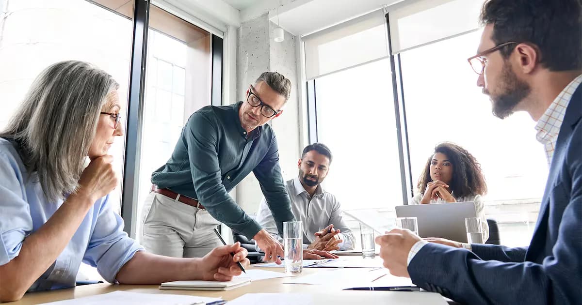 People sitting around a table in a boardroom