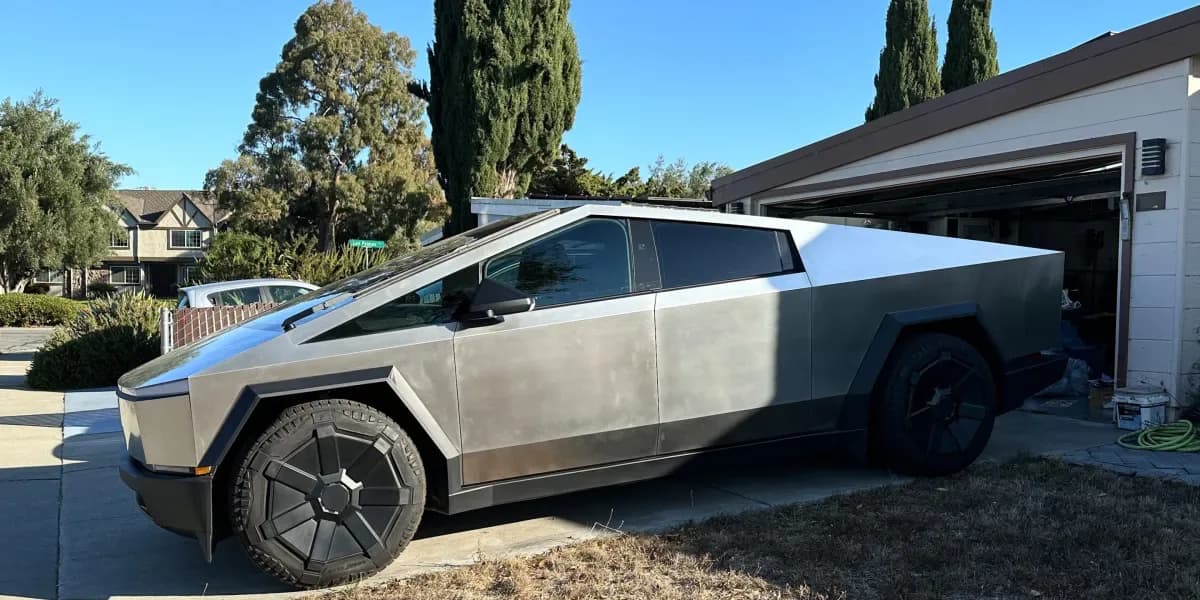 A Tesla Cybertruck parked in front of a Silicon Valley garage.