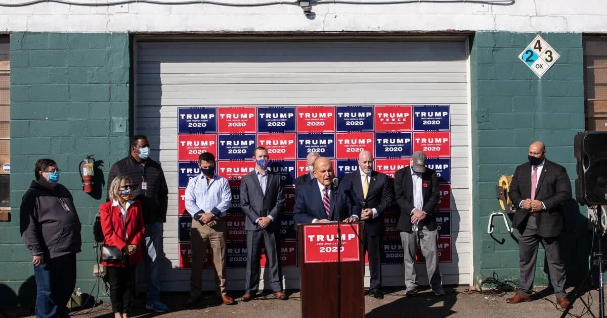 Rudy Giuliani, President Trump's attorney, speaks at a press conference held in the back parking lot of Four Seasons Total Landscaping on Saturday in Philadelphia.