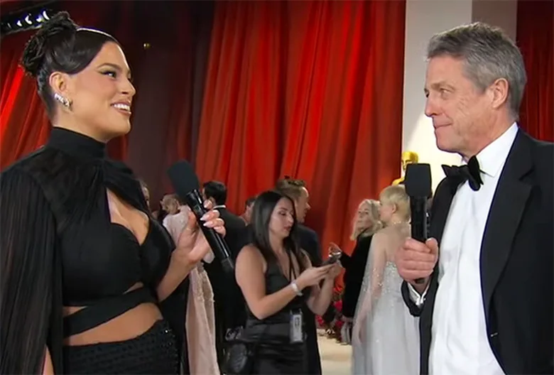 Oscars: Hugh Grant Shuts Down Ashley Graham In Mesmerizingly Awkward Red Carpet Interview — WATCH - TVLine