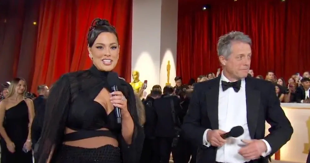 Hugh Grant's polarizing Oscars interview with model Ashley Graham goes viral