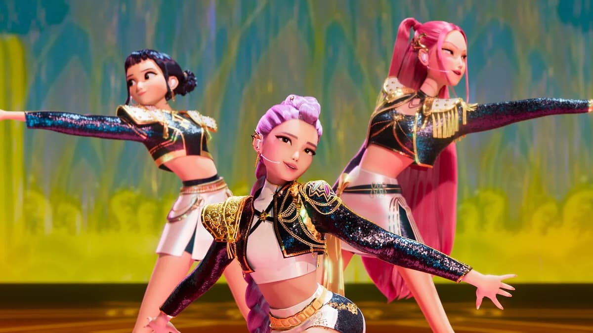 Animated still of three women performing onstage in 'KPOP Demon Hunters'