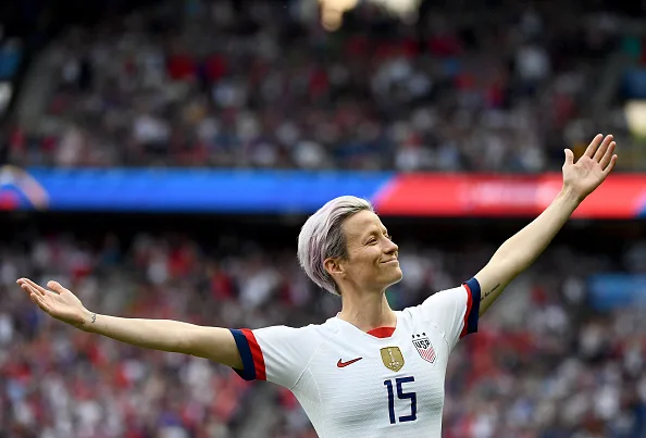 TOPSHOT - United States' forward Megan Rapinoe celebrates scoring her...
