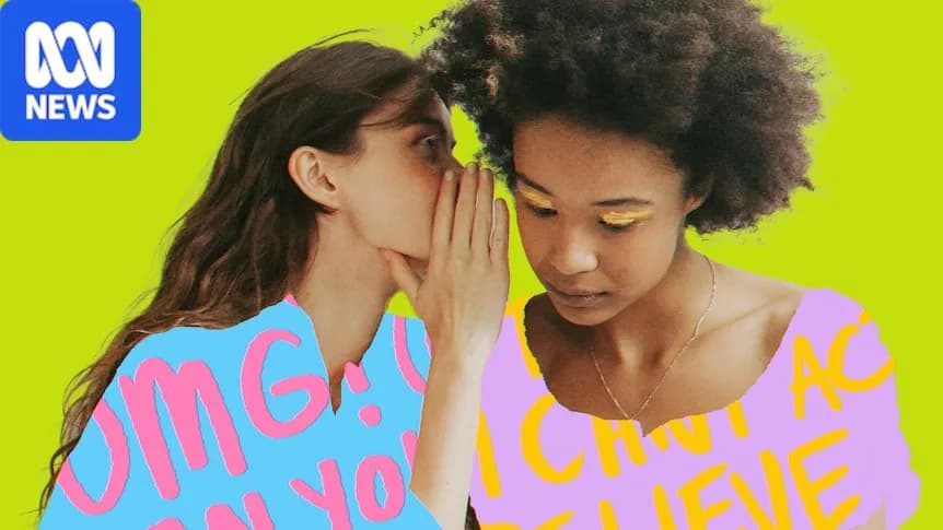 A white woman with long brown hair holds her hand to her face and whispers into the ear of a black woman wearing her afro out.