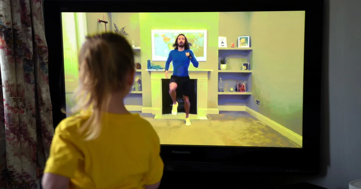 Four-year-old Lois Copley-Jones, the photographer's daughter, takes part in a livestreamed broadcast of "PE With Joe" on March 23, 2020, in Newcastle-under-Lyme, England. The popular fitness series…