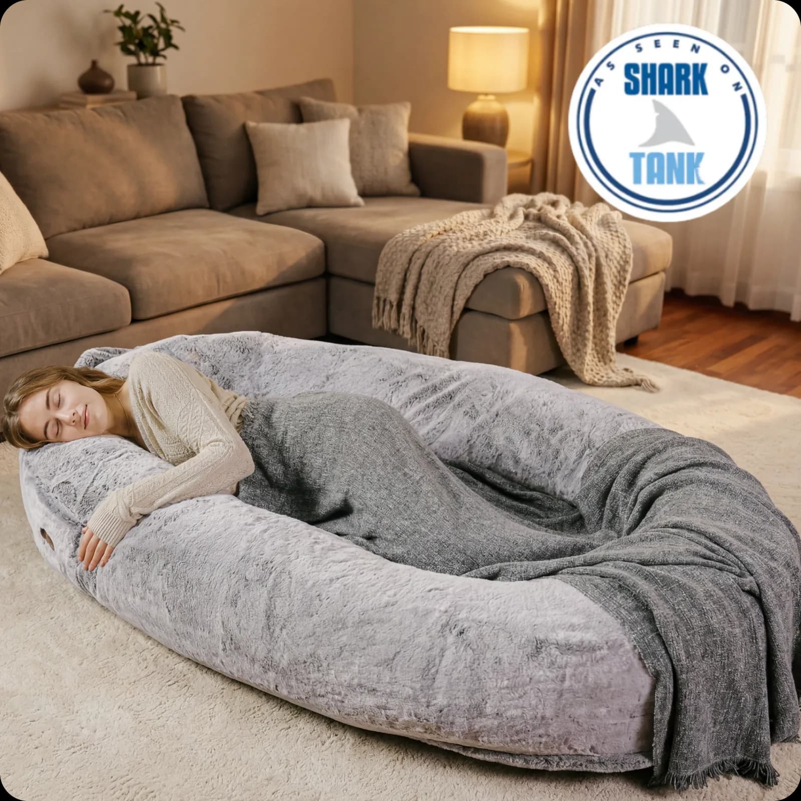 Plufl’s human dog bed with its faux-fur cover and raised pillow border.