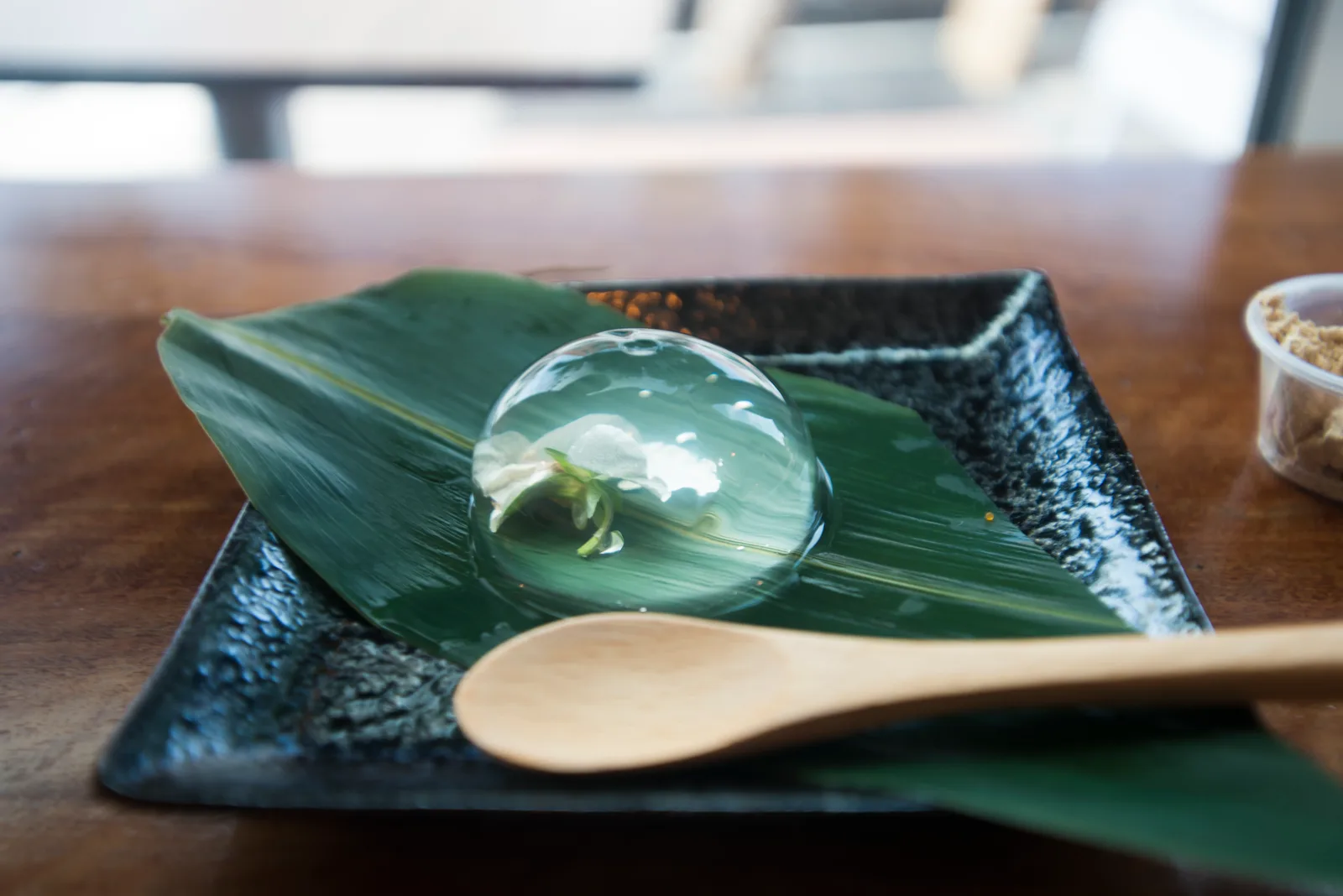 A raindrop cake is a Japanese dish made from water and agar that resembles a bead of water on a surface.