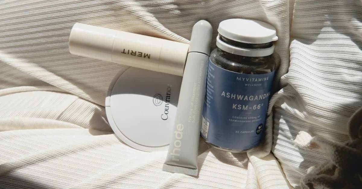 Photo of skincare products on a bed