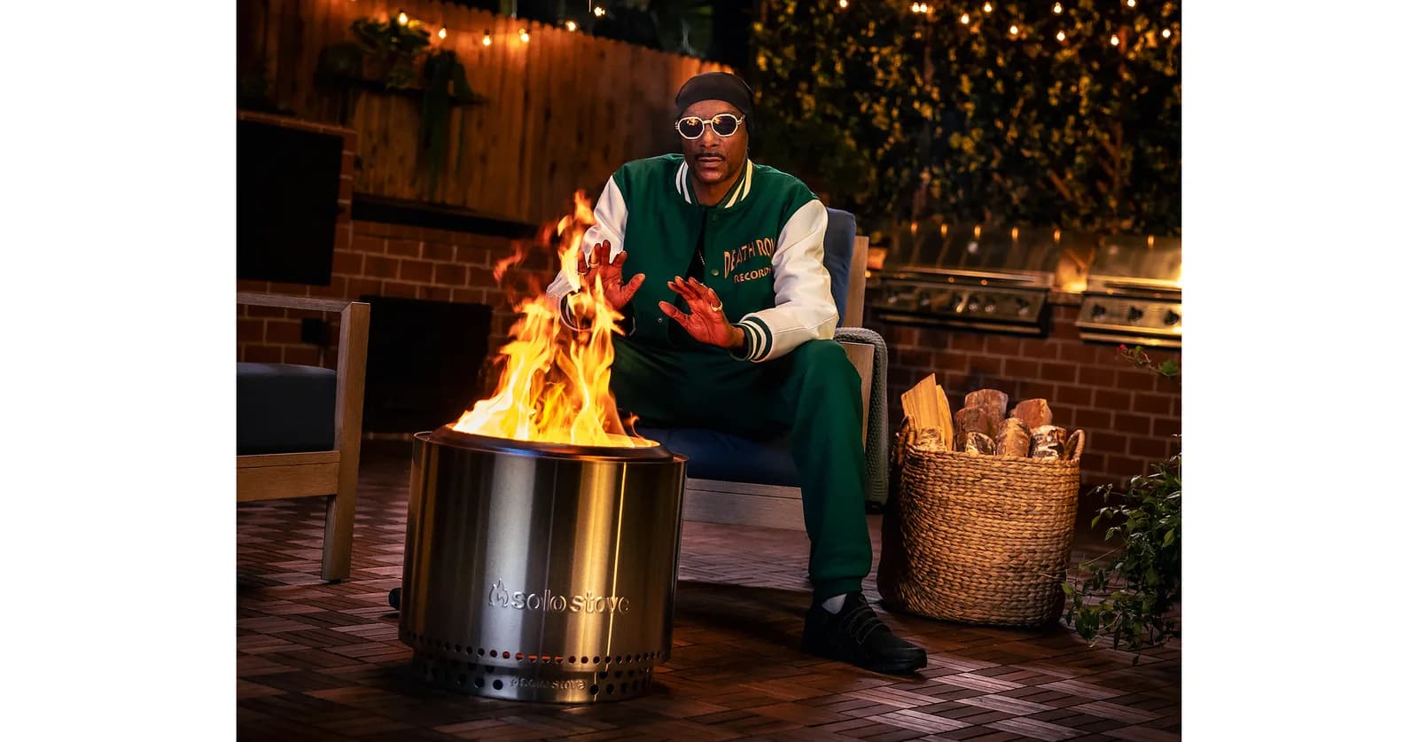 Official launch photograph of Snoop Dogg by the Solo Stove fire pit.