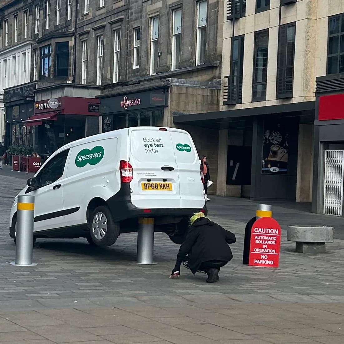 the irony of this being a specsavers van that's parked on the rising bollards RIGHT NEXT TO the big red sign saying not to do exactly that is not lost on me