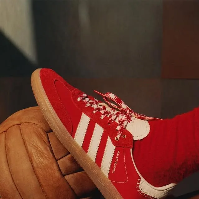 Red Wales Bonner Samba beside a vintage football