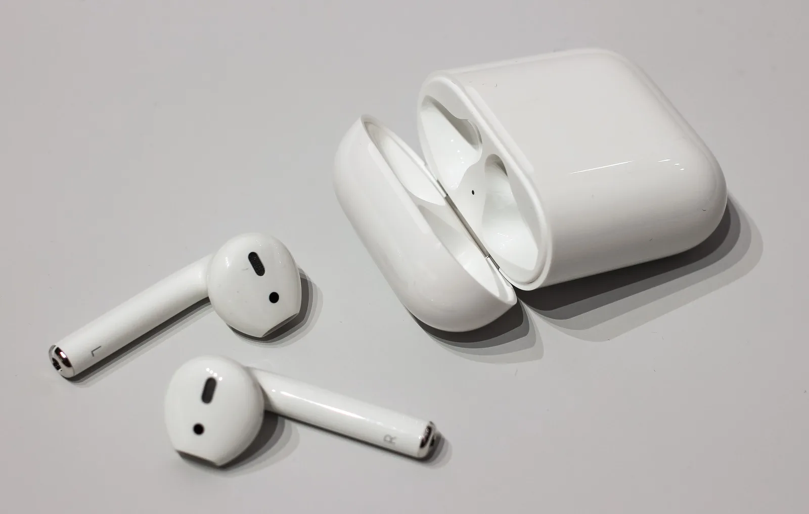 First-generation AirPods at the launch event