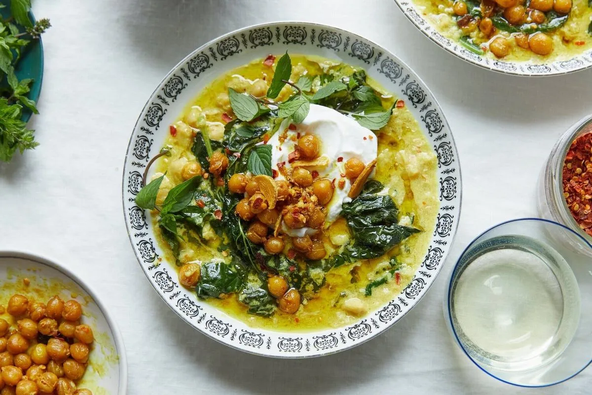 A bowl of Alison Roman’s chickpea stew with greens, mint and yogurt.