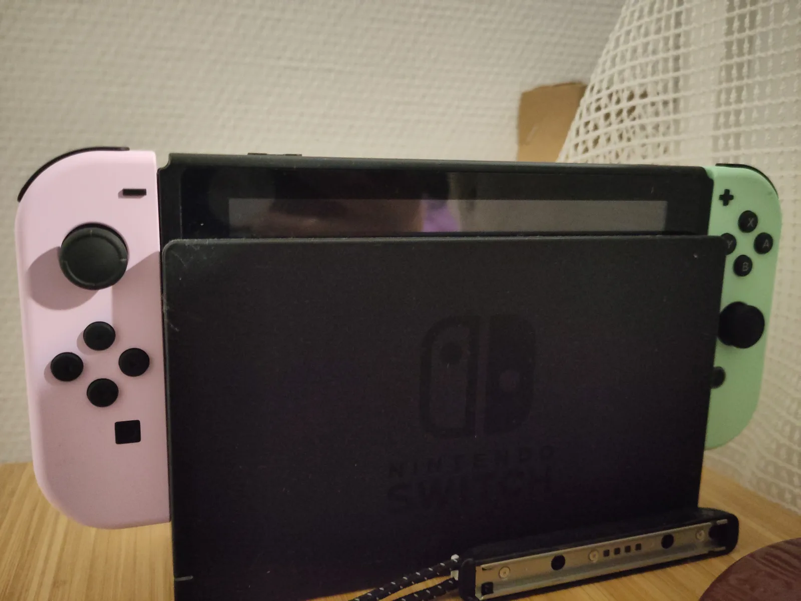 Nintendo Switch with Animal Crossing Joy-Con in its dock