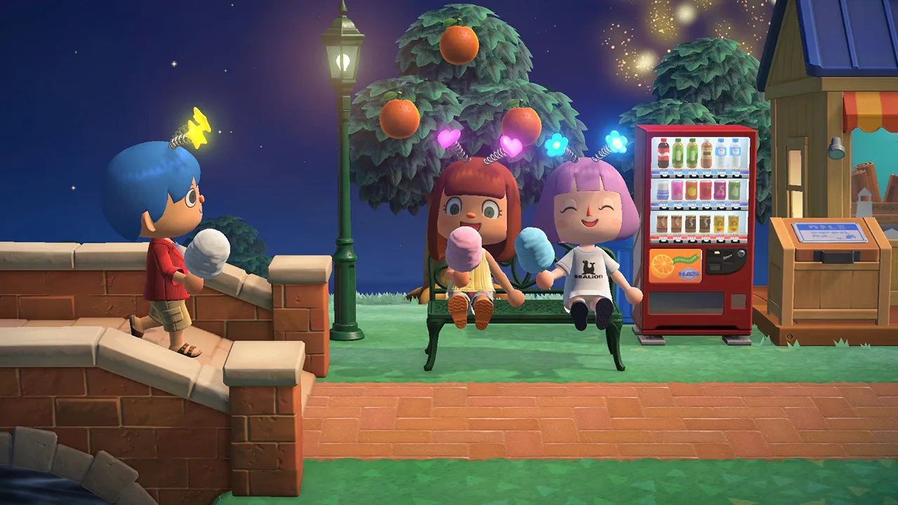 Players sit outside under fireworks in a Nintendo screenshot