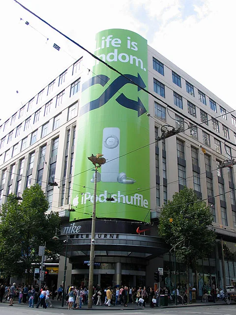 iPod shuffle silhouette advertising in Melbourne, photographed in February 2005; CC BY-SA 2.0.