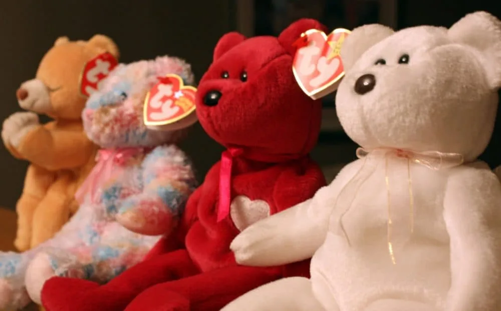 A row of Beanie Baby bears with their heart-shaped Ty tags