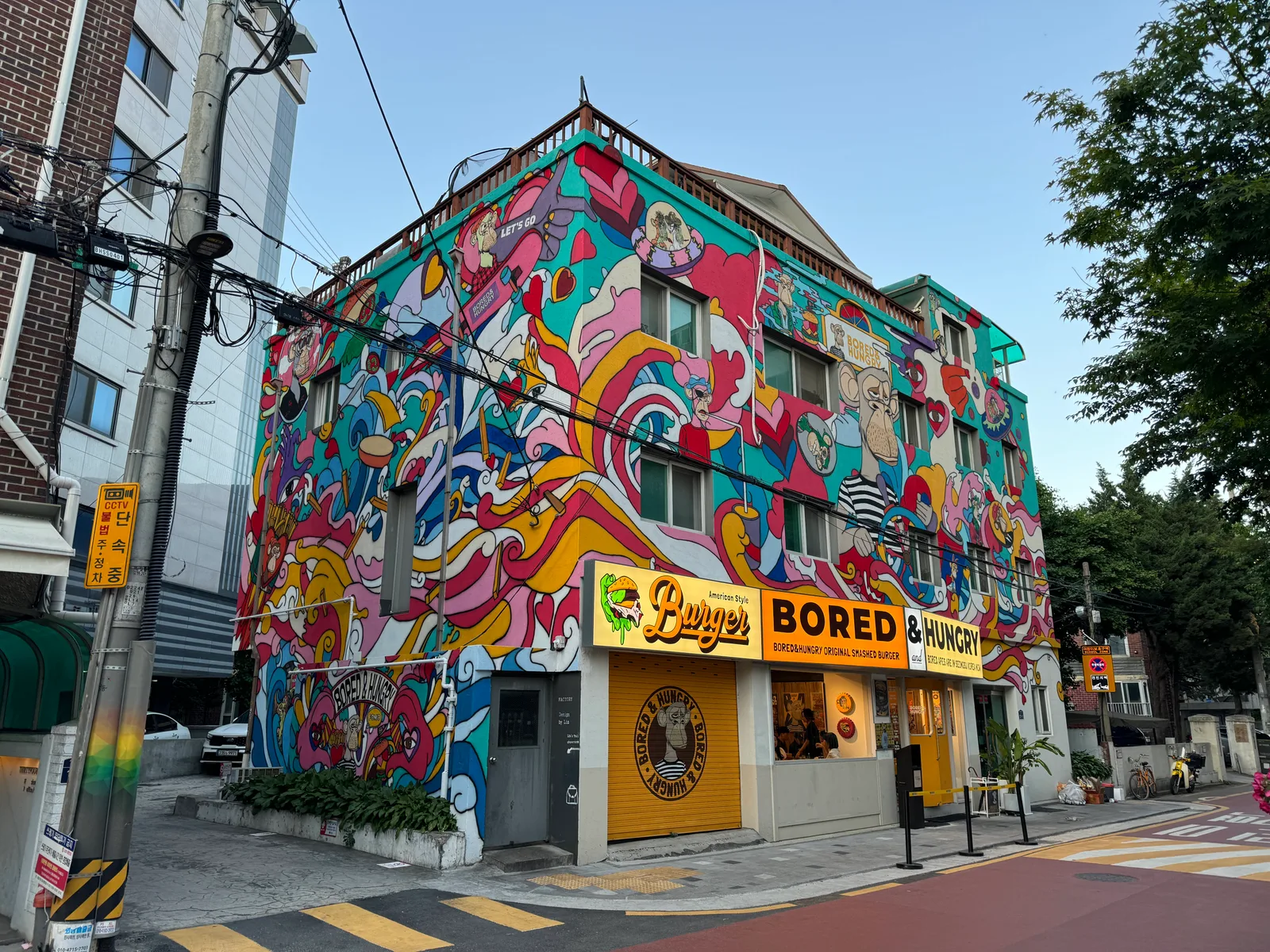 A Bored & Hungry storefront displaying ape branding, photographed in 2024.