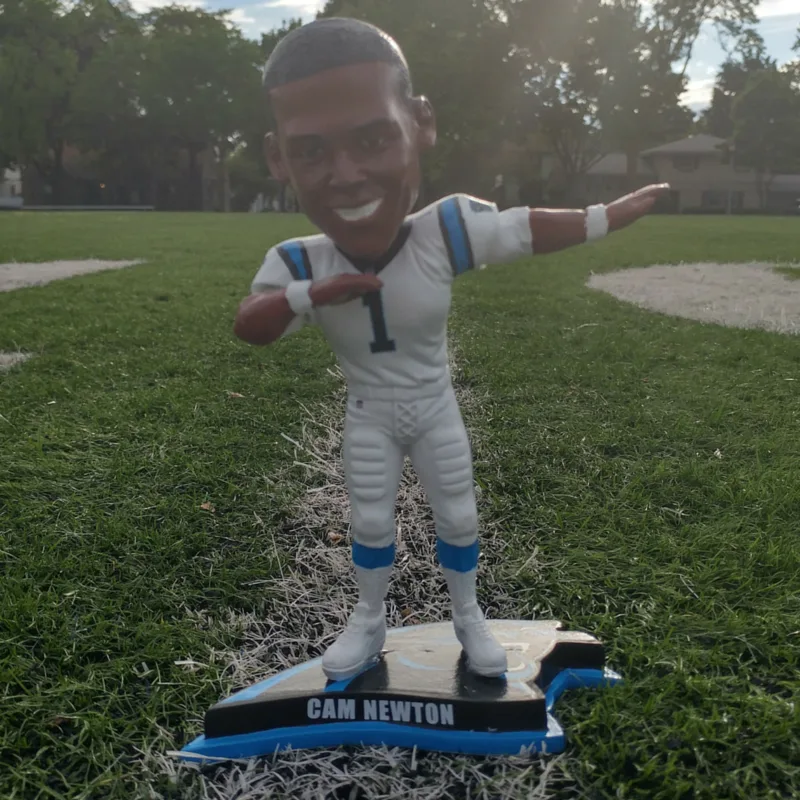 Cam Newton dabbing bobblehead with movable head and arms.