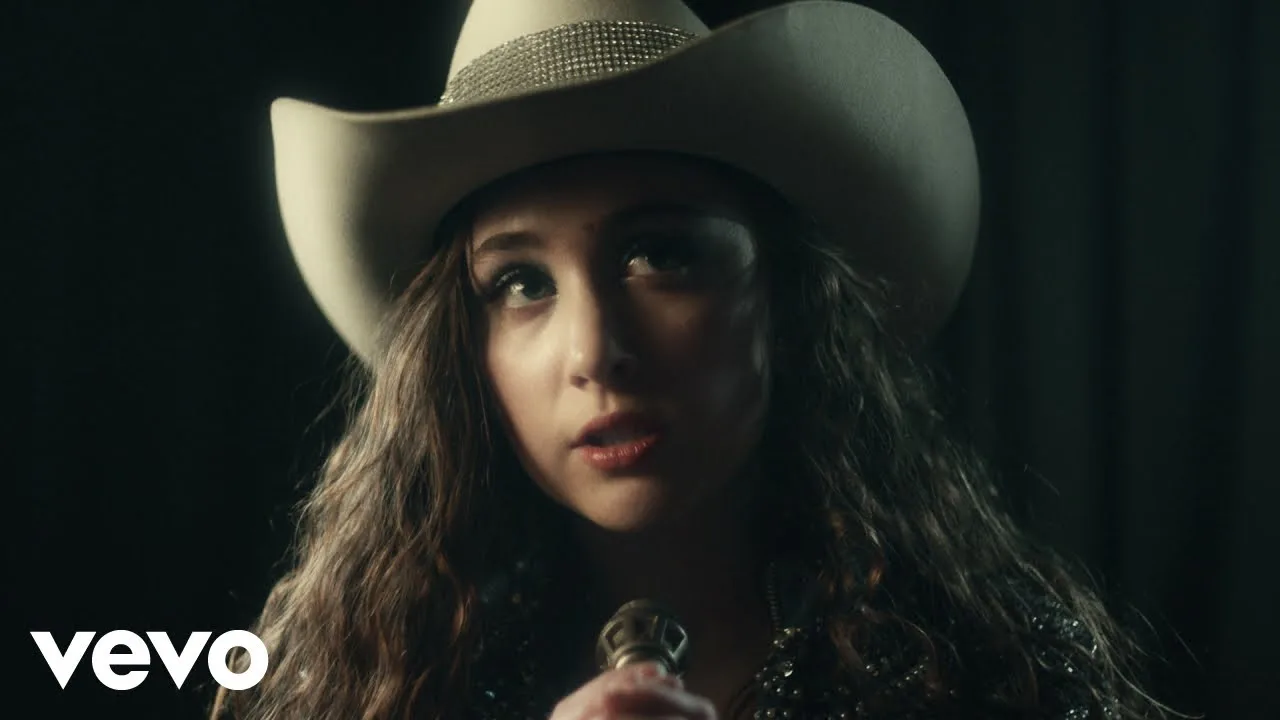 Chappell Roan in a cowboy hat in the Pink Pony Club video