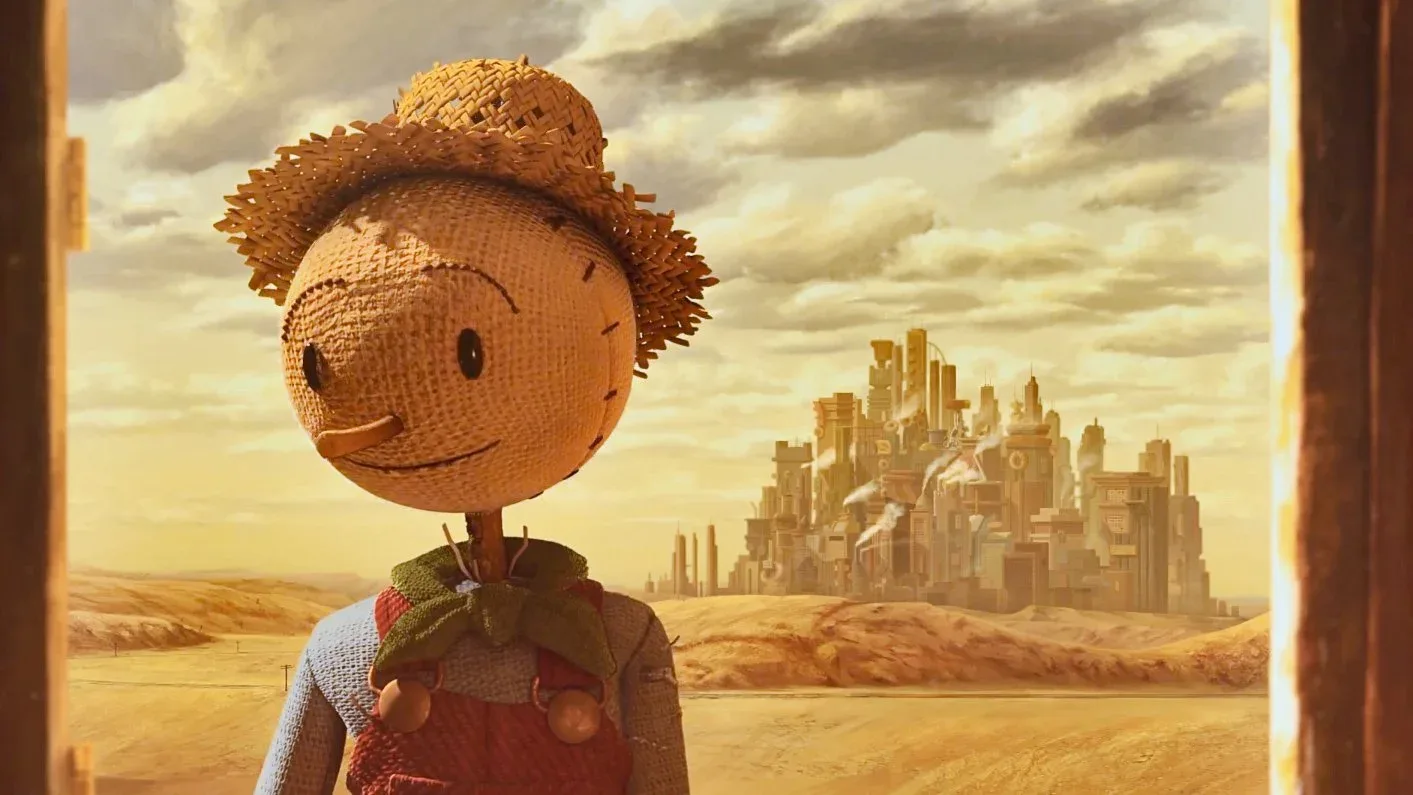 A frame from the film showed the Scarecrow in a doorway with the factory city behind him.