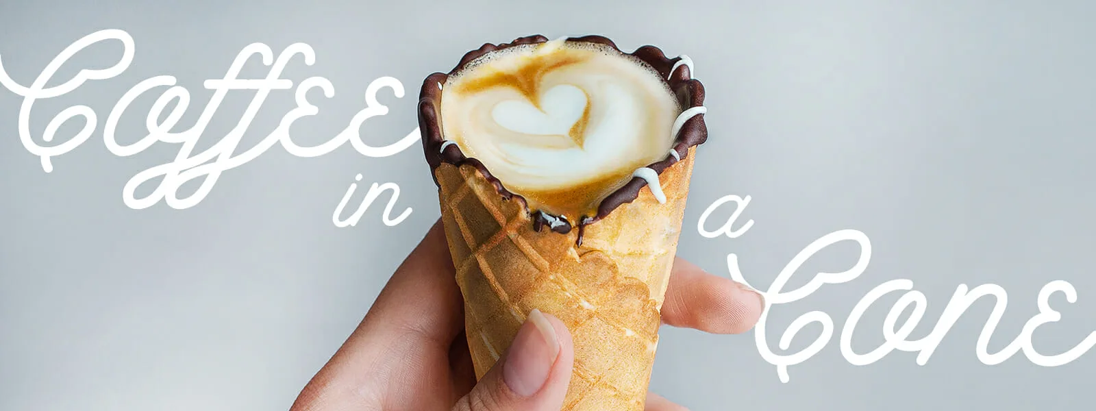 Latte art in chocolate-lined waffle cones sold by Bluestone Lane.
