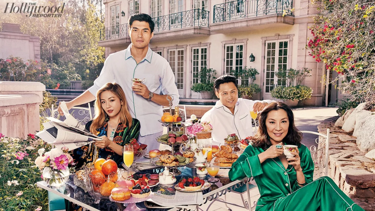 The Crazy Rich Asians cast around a laden table.