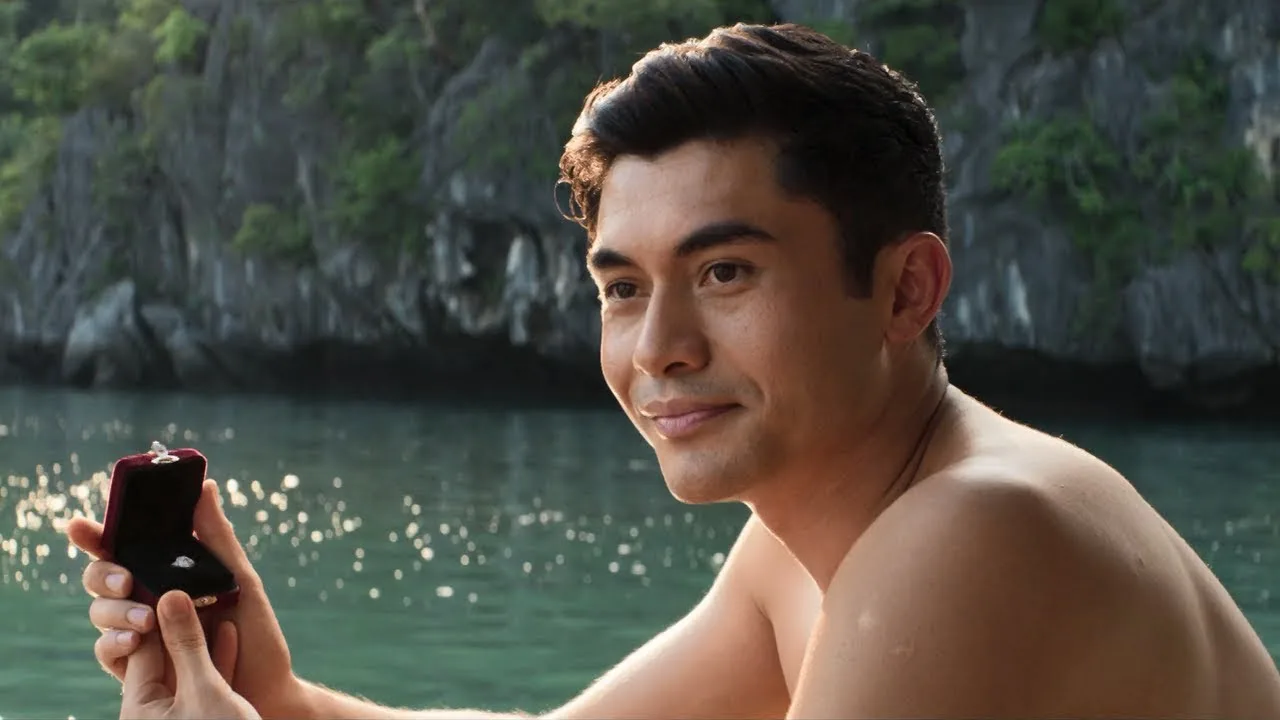 Henry Golding with a ring box in the official trailer.