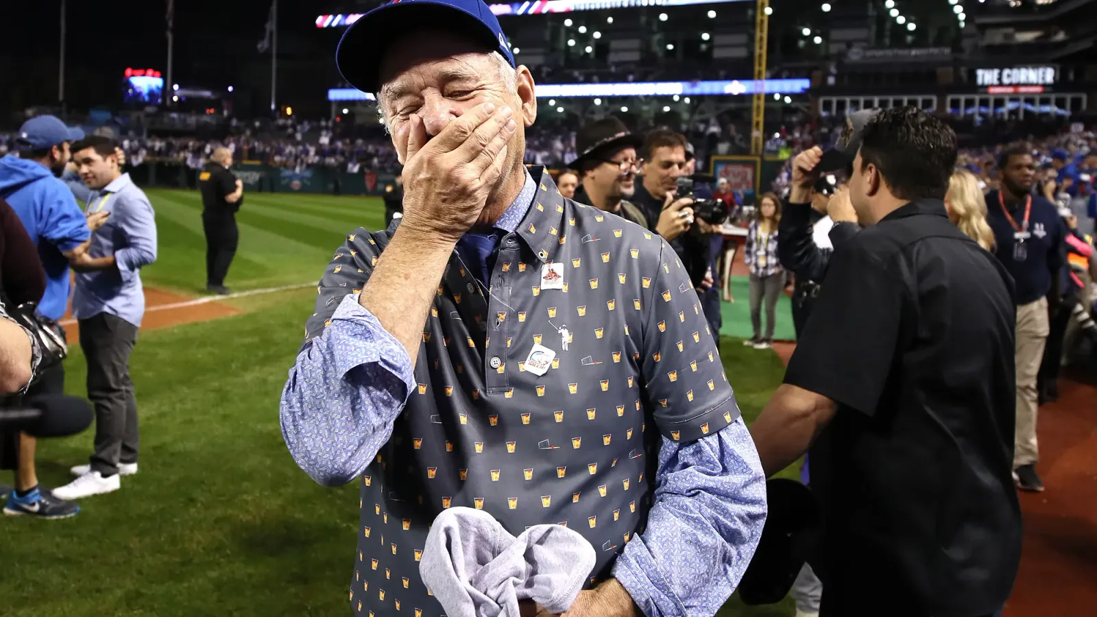 Bill Murray, overcome, on the field after the Cubs won Game 7