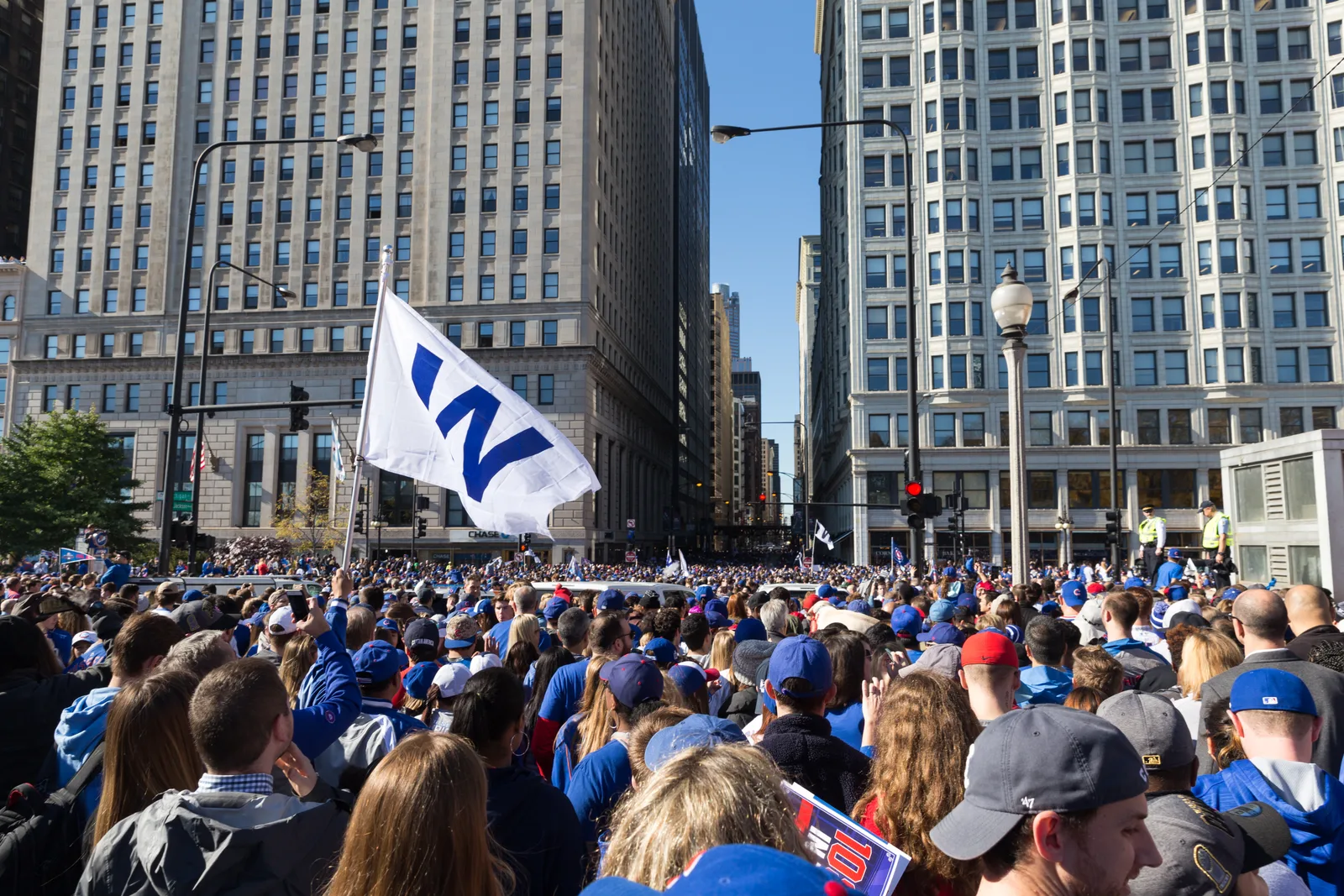 Fans wave W flags downtown during the 4 November Cubs rally