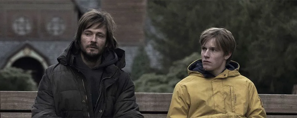 Two Dark characters on a bench