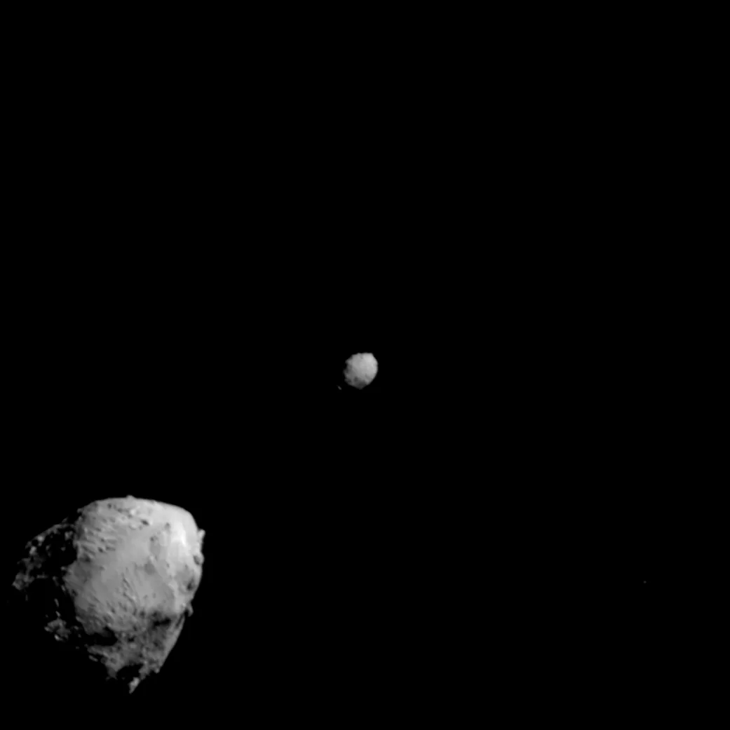 Asteroid Didymos (bottom left) and its moonlet, Dimorphos, about 2.5 minutes before the impact of NASA’s DART spacecraft.