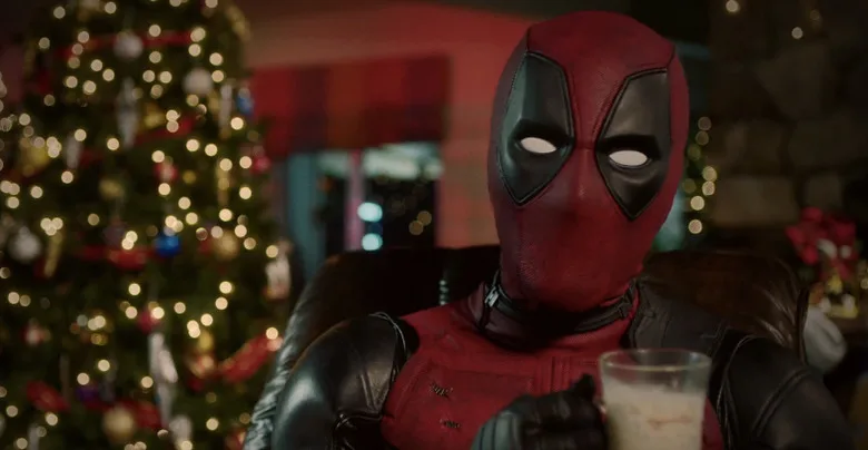Deadpool by a Christmas tree in the 12 Days of Deadpool campaign