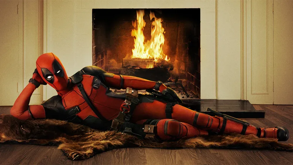 Deadpool reclining by a fireplace on a bearskin rug