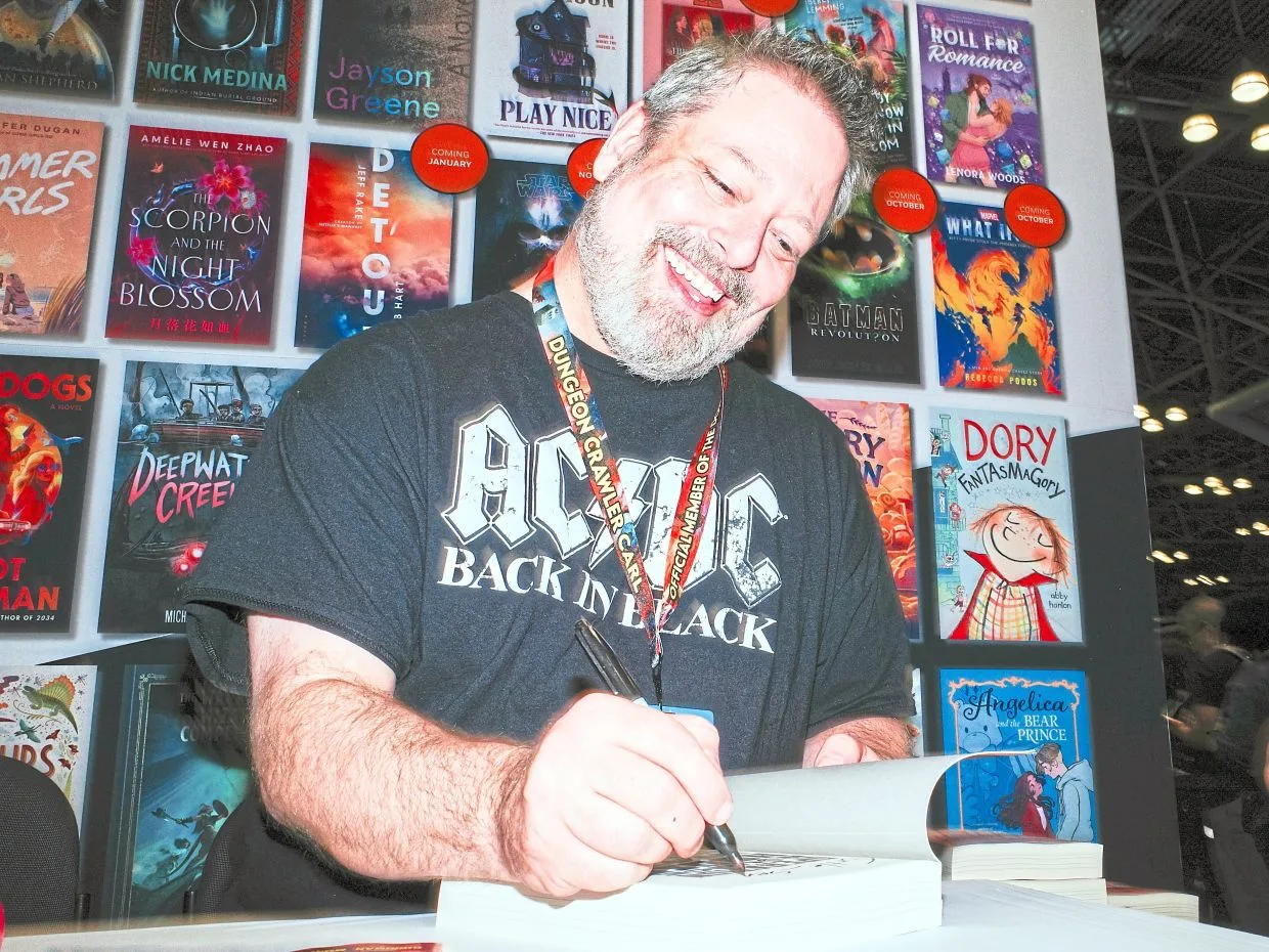 Matt Dinniman signing books