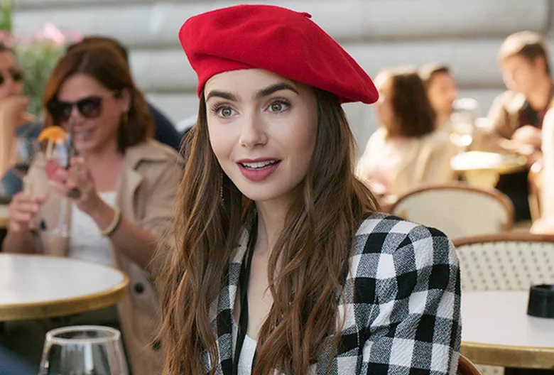 Emily in a red beret at a Paris café.