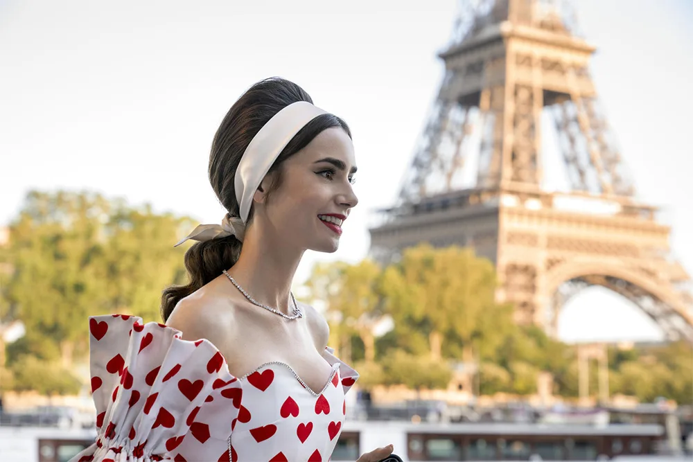 Emily in front of the Eiffel Tower.