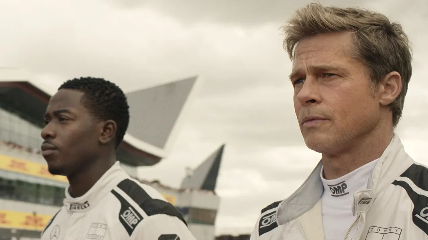 (L-r) DAMSON IDRIS as Joshua Pearce and BRAD PITT as Sonny Hayes in Apple Original Films’ “F1® The Movie,”
