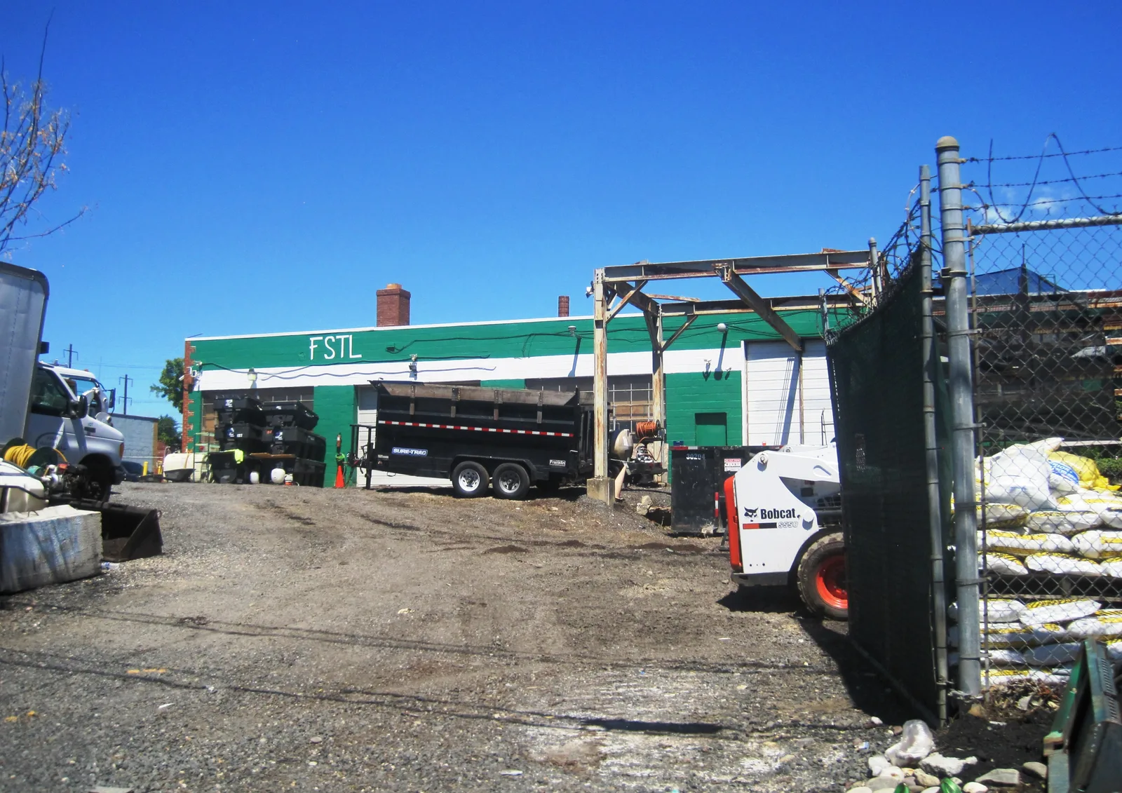 The rear of Four Seasons Total Landscaping in June 2024, photographed from Melrose Street.