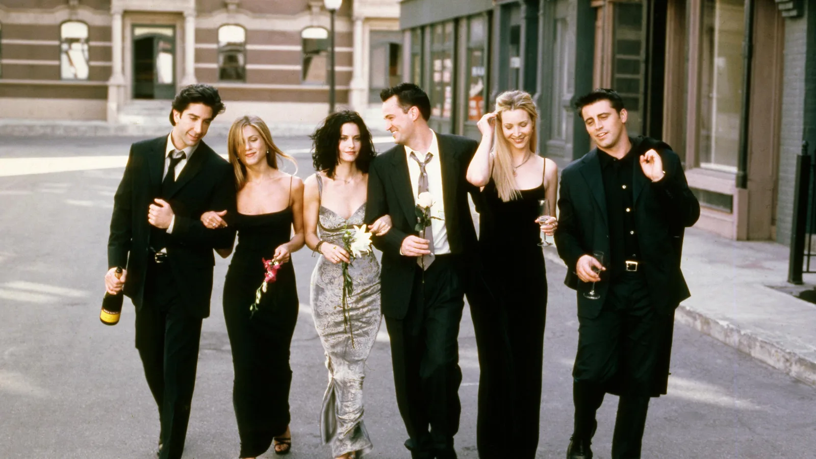 The cast walking down a street in black outfits, a season 6 promotional photo