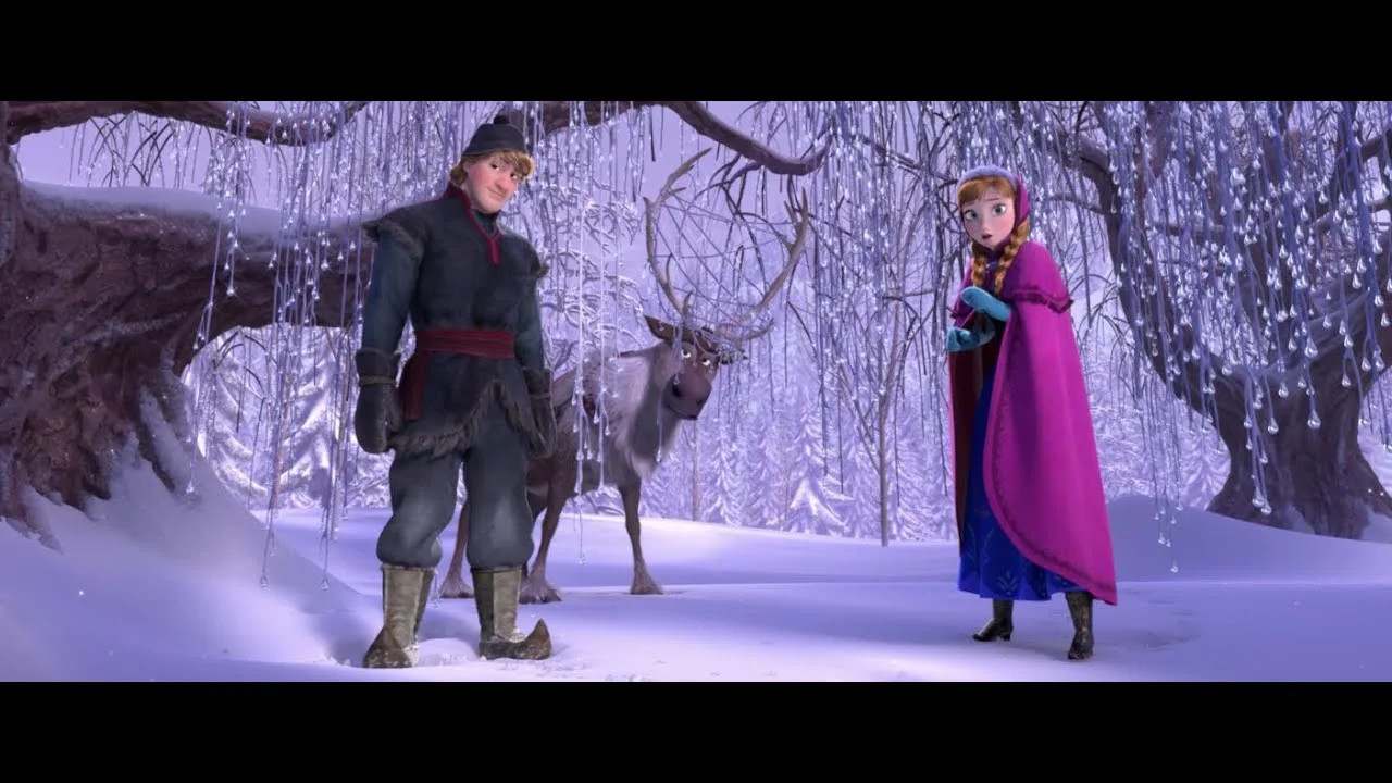 Kristoff, Sven and Anna in a snowy forest, from the official trailer.