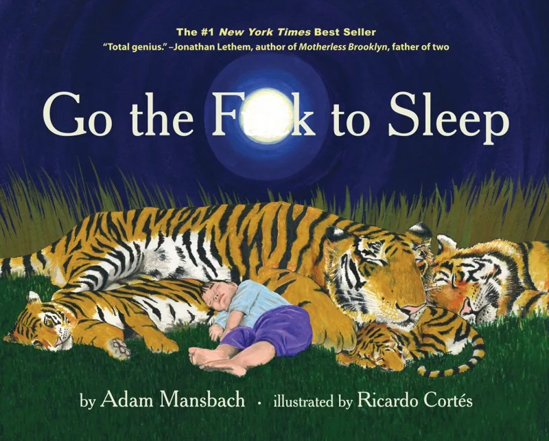 Official cover with a sleeping child among tigers.
