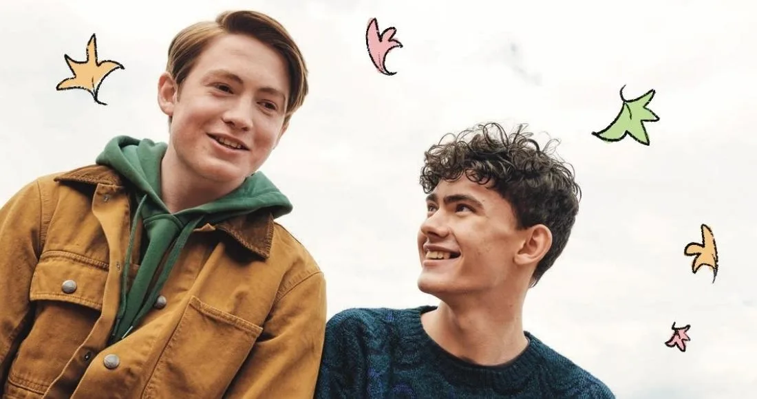 Kit Connor and Joe Locke as Nick and Charlie, with the show's hand-drawn leaves.